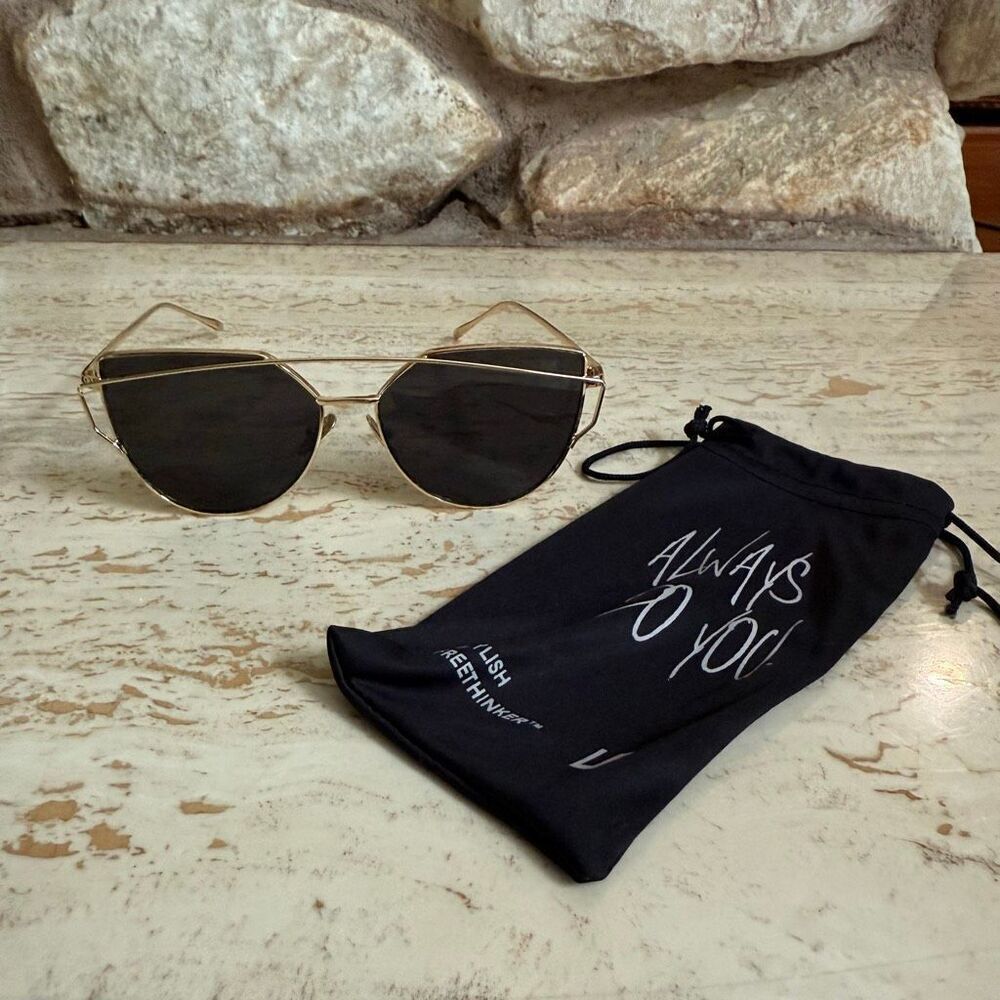 Gold wire frame cat eye aviator sunglasses with black lenses